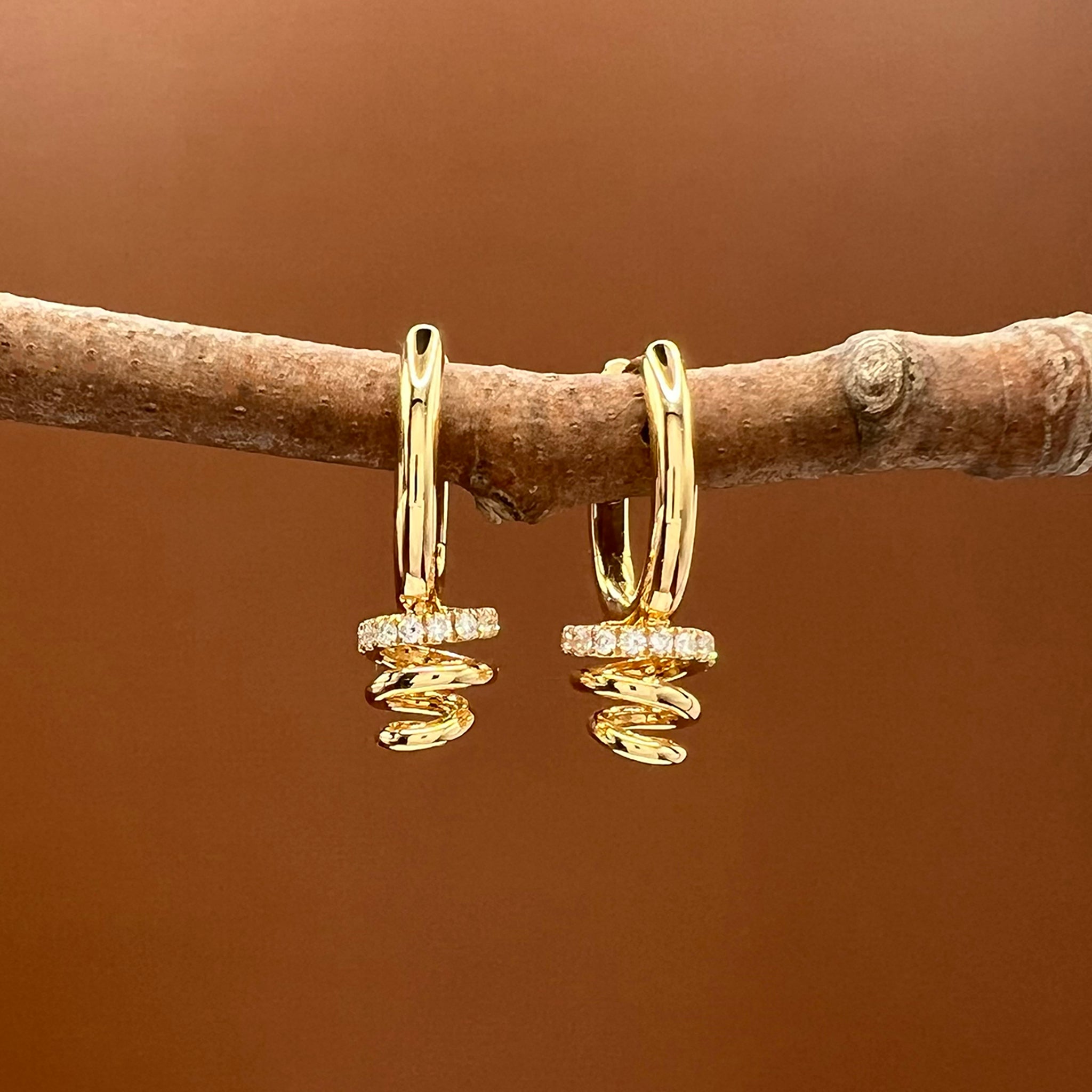 Diamond Accented Swirl Earrings