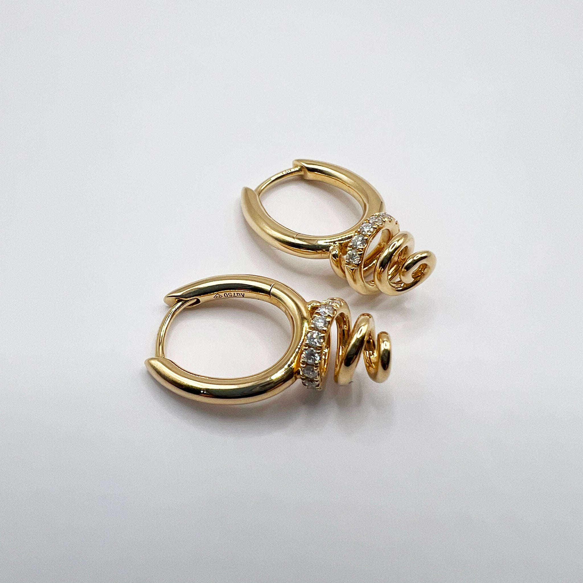 Diamond Accented Swirl Earrings